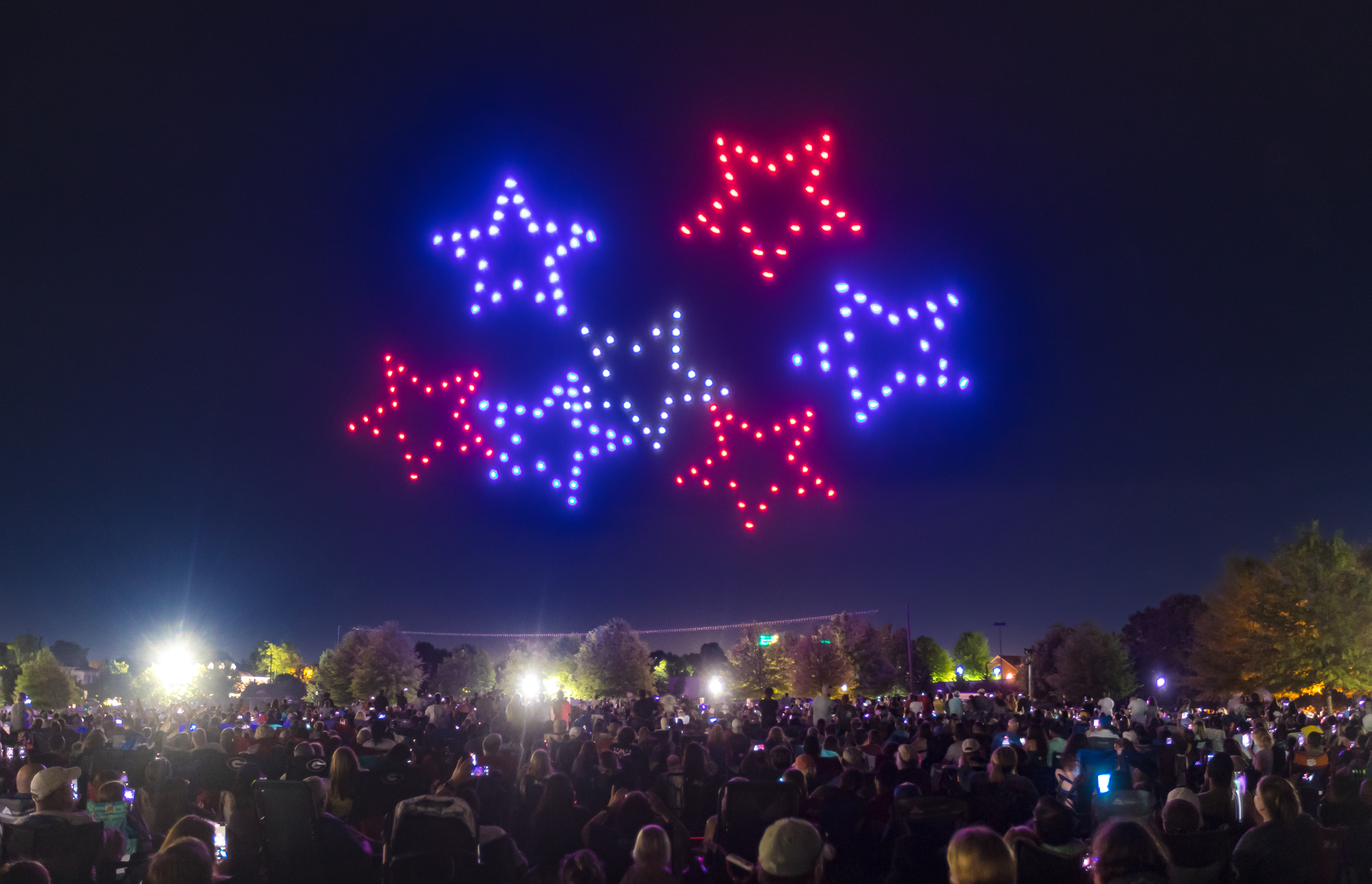 red white and blue stars during drone show
